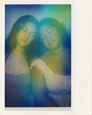 Aura portrait of two people leaning together with a green aura